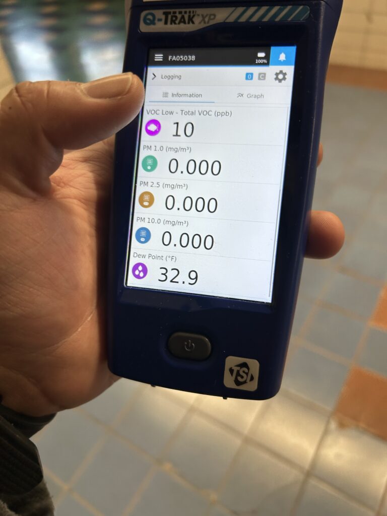 Photo of IAQ Meter measuring indoor air quality in a commercial building.